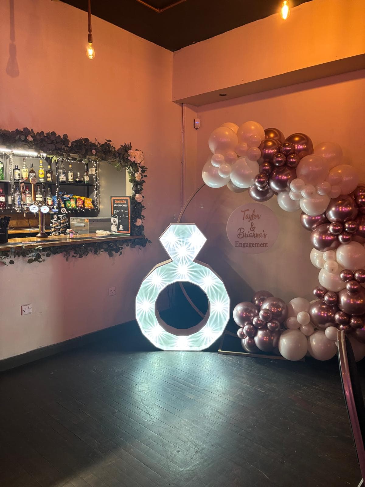 Light-up engagement ring with rose gold balloon arch